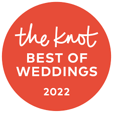 A red circle with the words `` the knot best of weddings '' written on it.