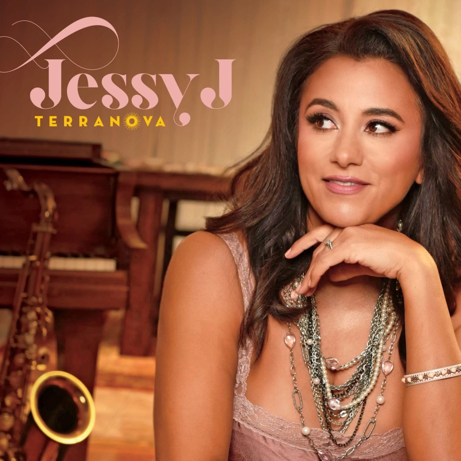 Jessy J album cover. Woman in pink top, hand on chin. Saxophone in background.