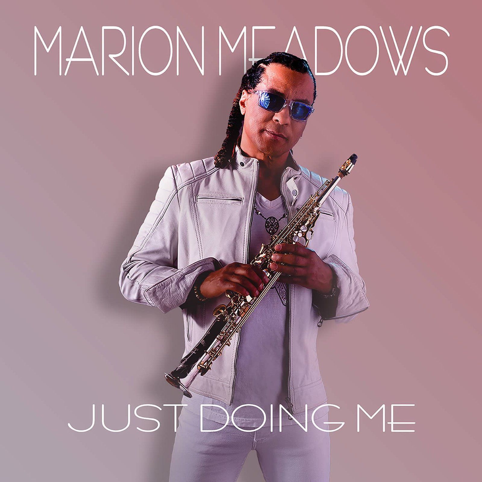 Marion Meadows, saxophonist, in white outfit and sunglasses, holding a soprano saxophone, album cover.