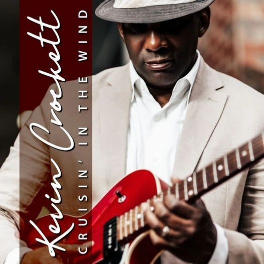Kevin Crockett holding a red guitar, wearing a fedora and beige suit, album cover for 