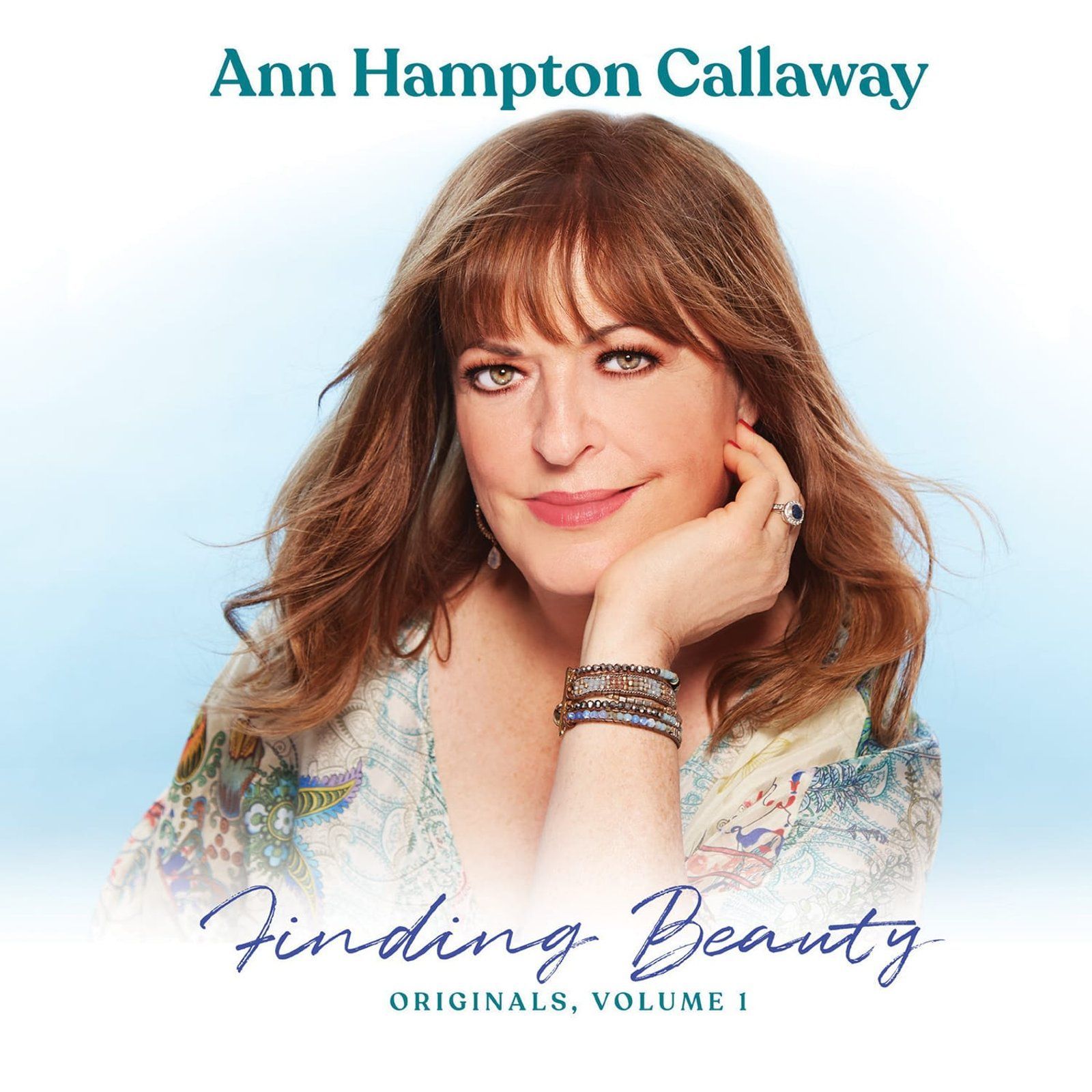 Ann Hampton Callaway album cover, smiling with hand on face. Blue background.