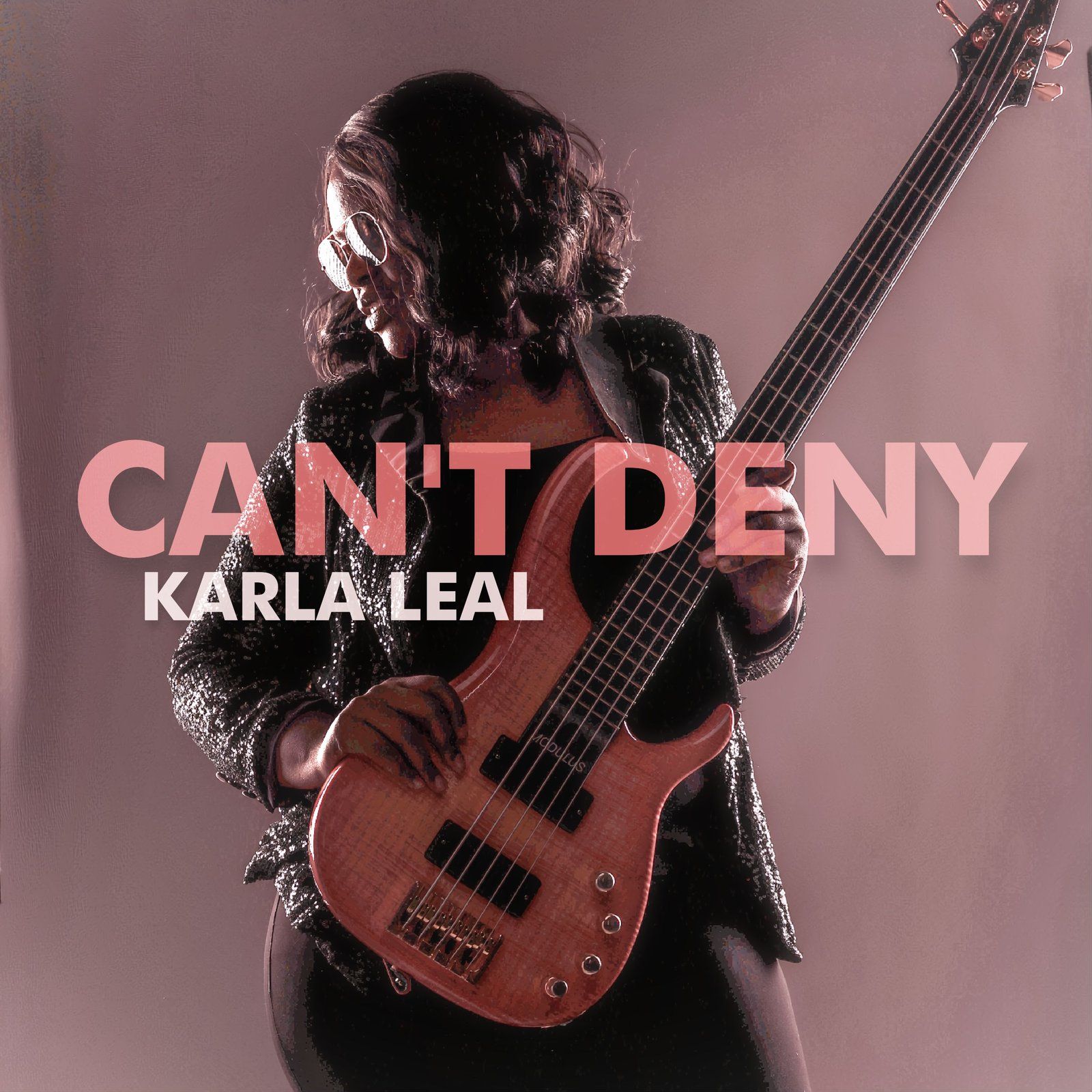 Karla Leal holding a bass guitar, album cover for 