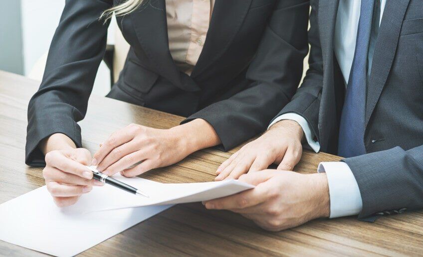 Two Lawyers Reading Document - Legal Services Northern Territory