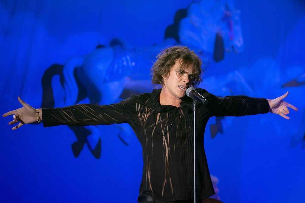 Singer Luke K on stage performing at the Carousel of Hope.