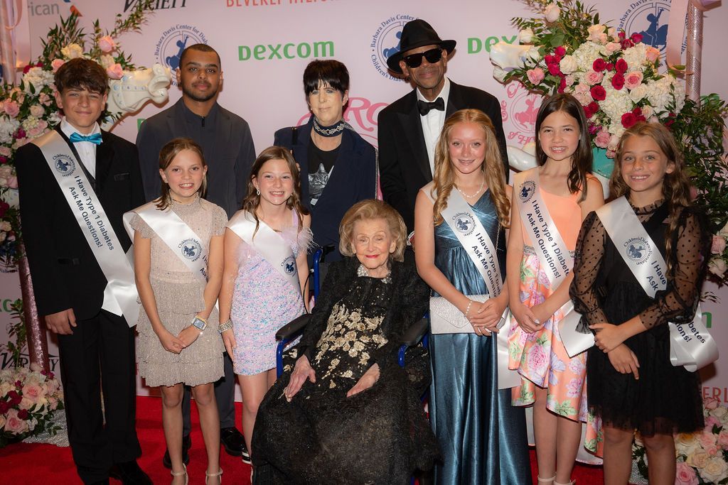Barbara Davis with Jimmy Jam and his son Max Harris, and several CDF T1D advocates.