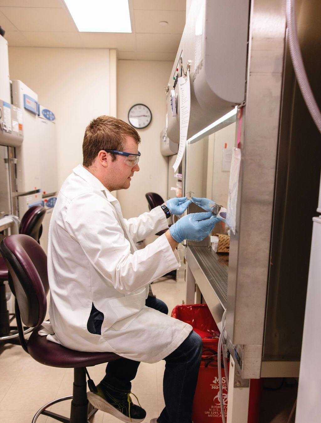 Man doing medical research in white lab coat at the BDC.