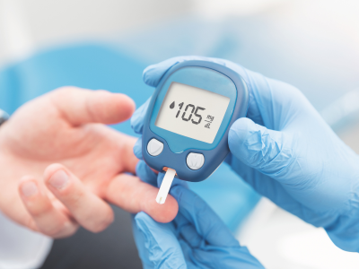 A person is being tested for diabetes by a doctor.