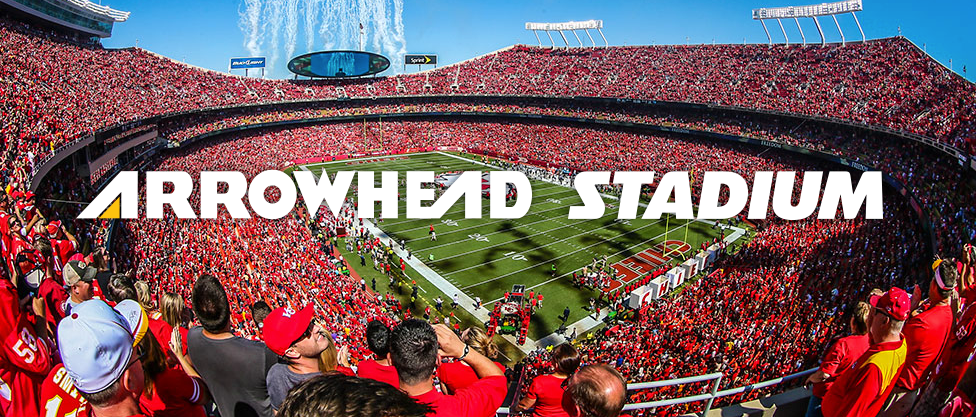 A large crowd of people are watching a football game at arrowhead stadium.