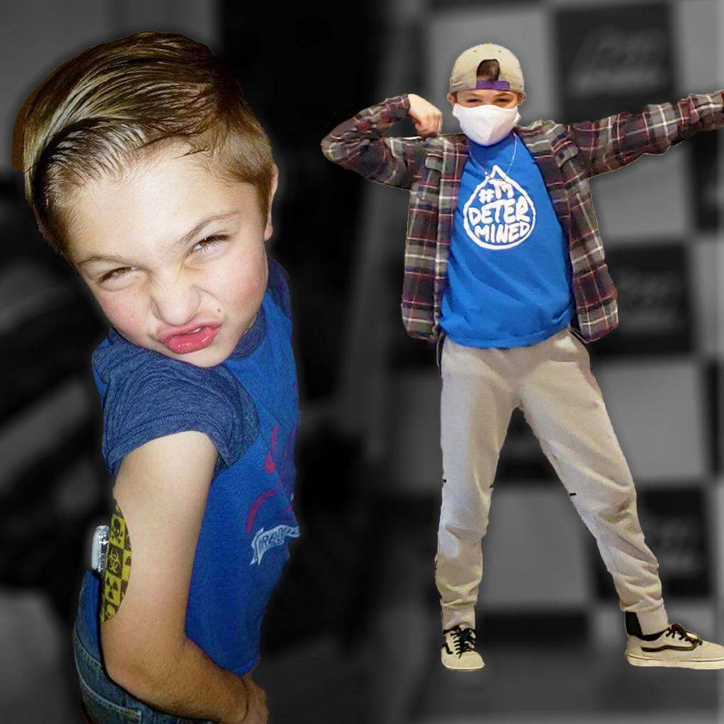 A boy wearing a blue shirt that says better miner