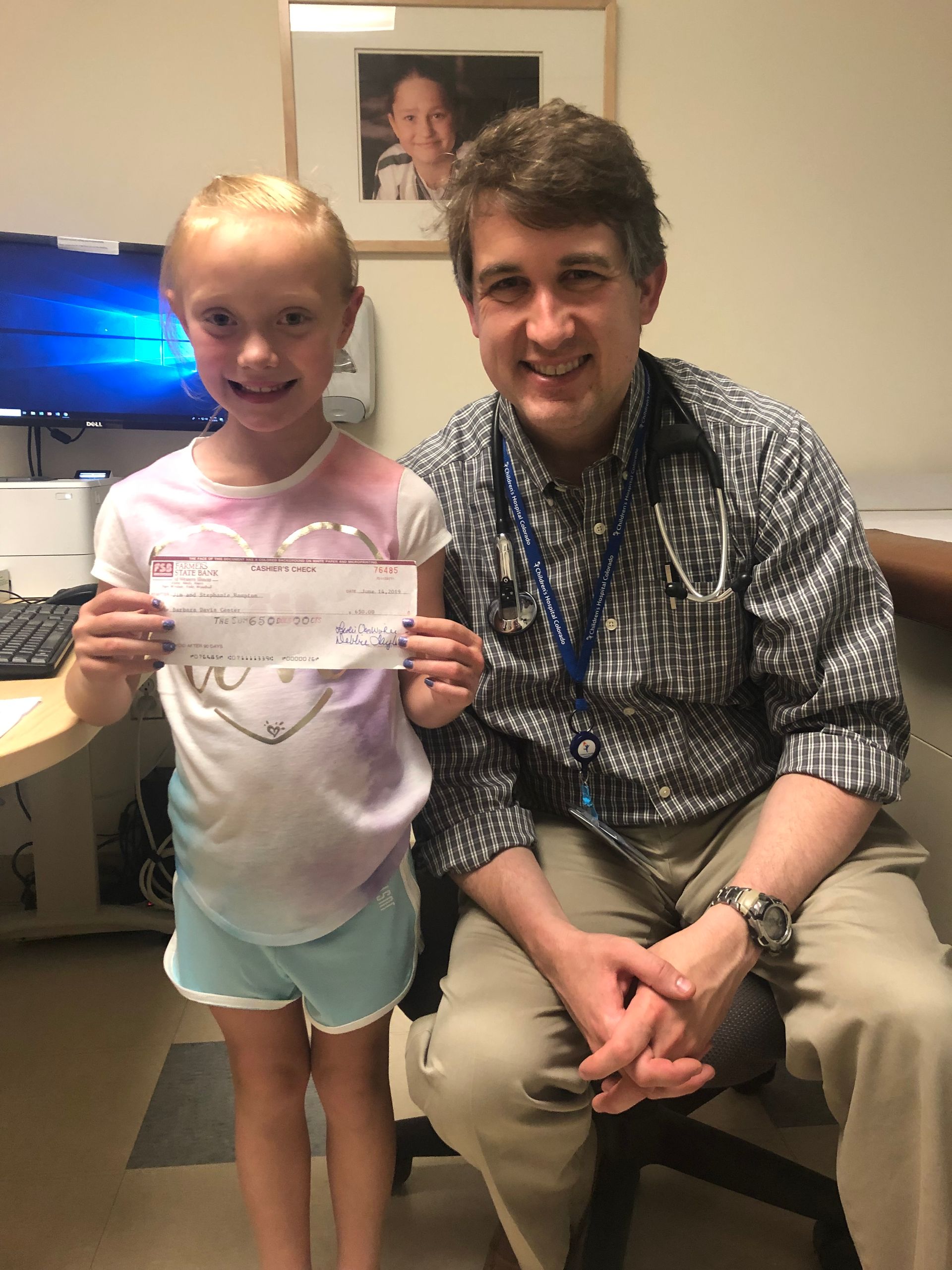 Dr. Forlenza sitting next to smiling young type 1 patient