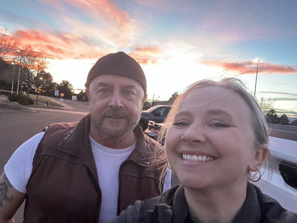 Author Lindsay Klatt and her father, smiling for the camera