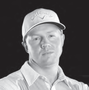 A black and white photo of a man wearing a hat.