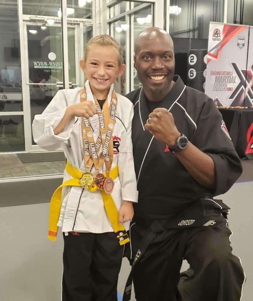 A man and a little girl are posing for a picture
