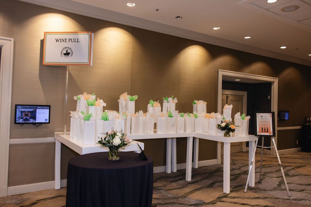 Gift bags of wine for the wine pull at the Brass Ring Luncheon and Fashion Show.