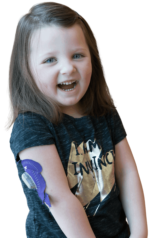Young smiling girl wearing CGM and 