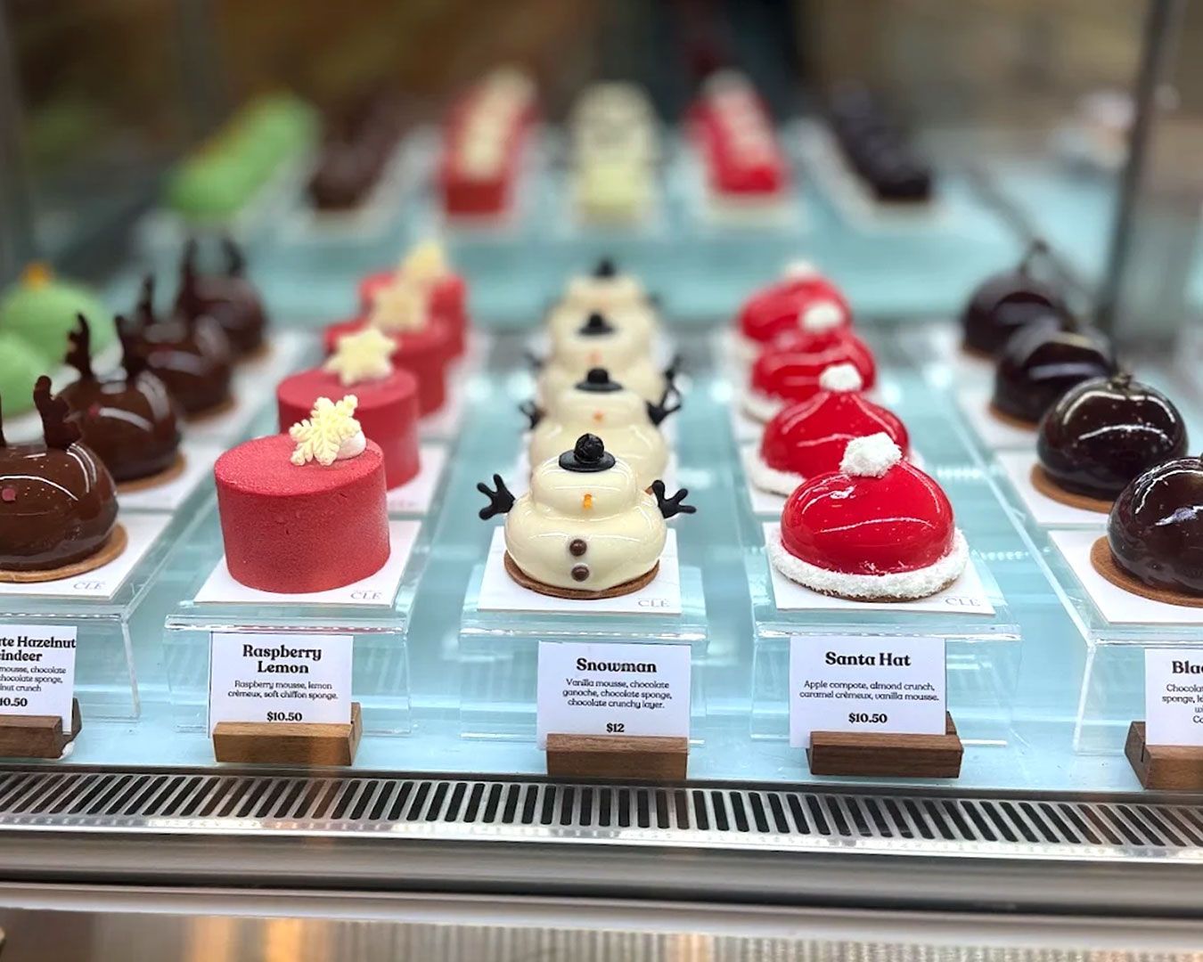 A glossy tart filled with tangy passionfruit curd and layered with nutty black sesame cream.