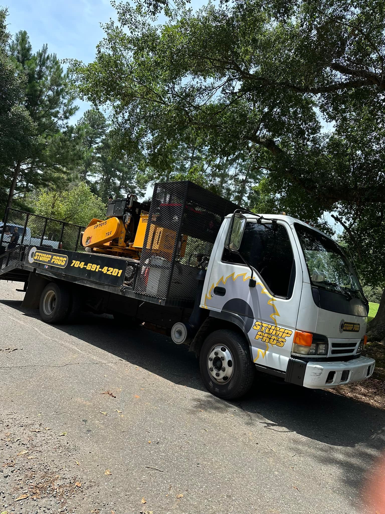 A tow truck is parked on the side of the road.