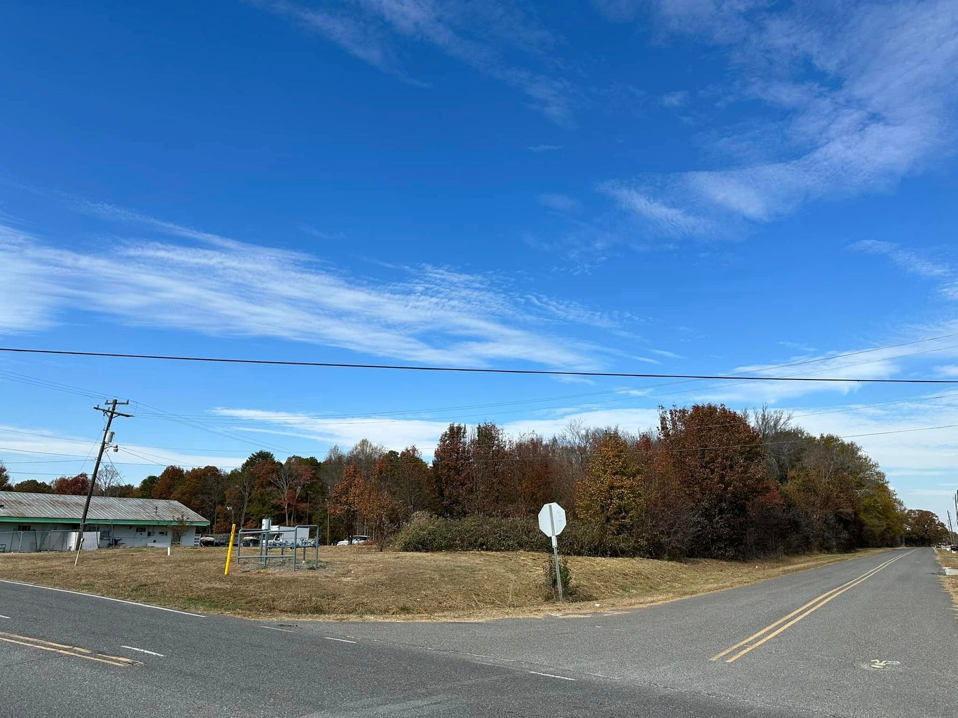 There is a no parking sign on the side of the road.