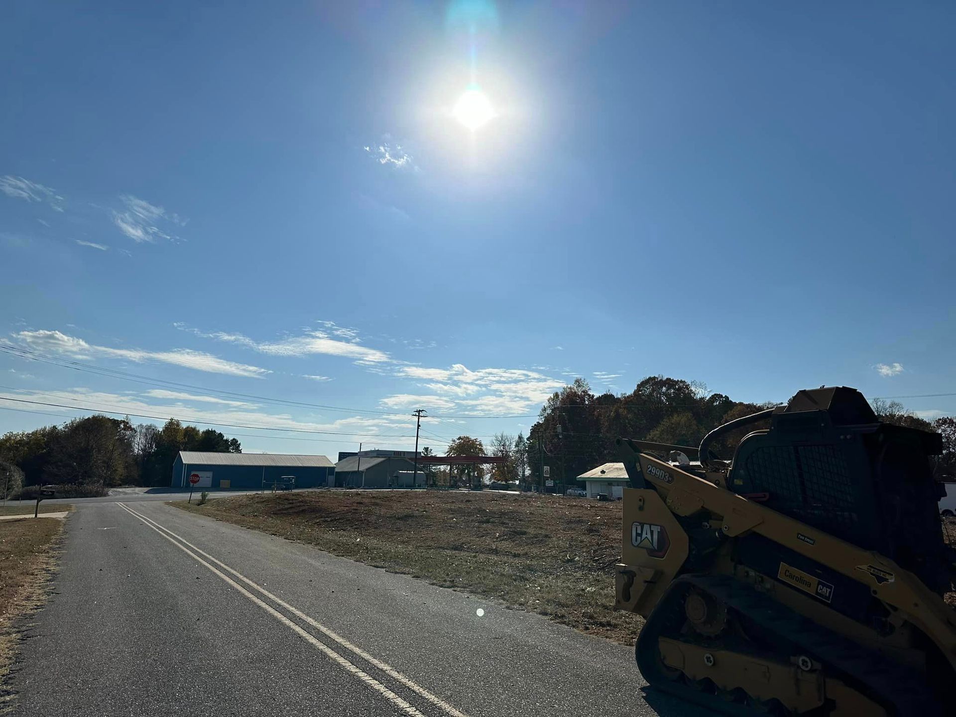 A bulldozer is parked on the side of a road.
