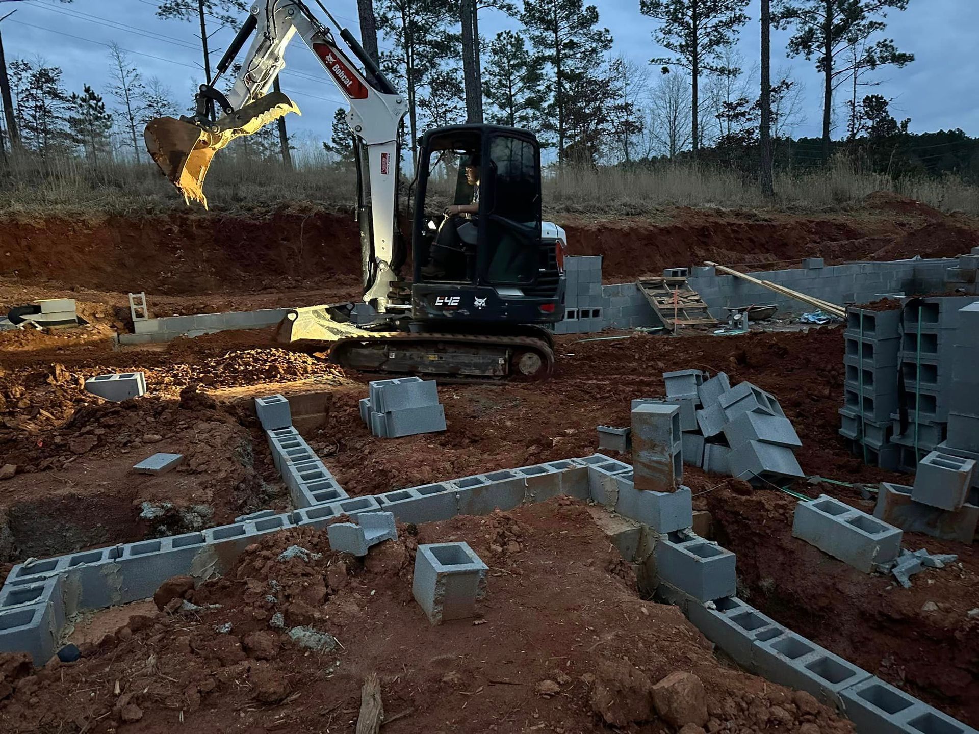 A man is driving a bulldozer on a construction site