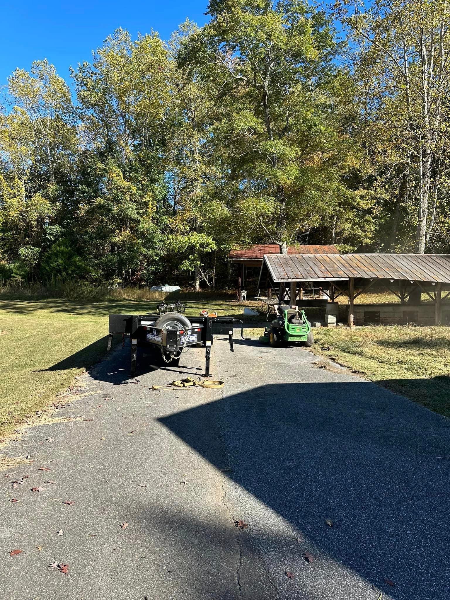 Two atvs are parked on the side of the road in a park.