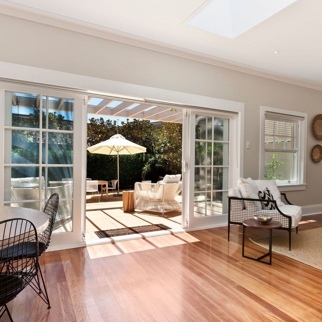 A living room with sliding glass doors leading to a patio