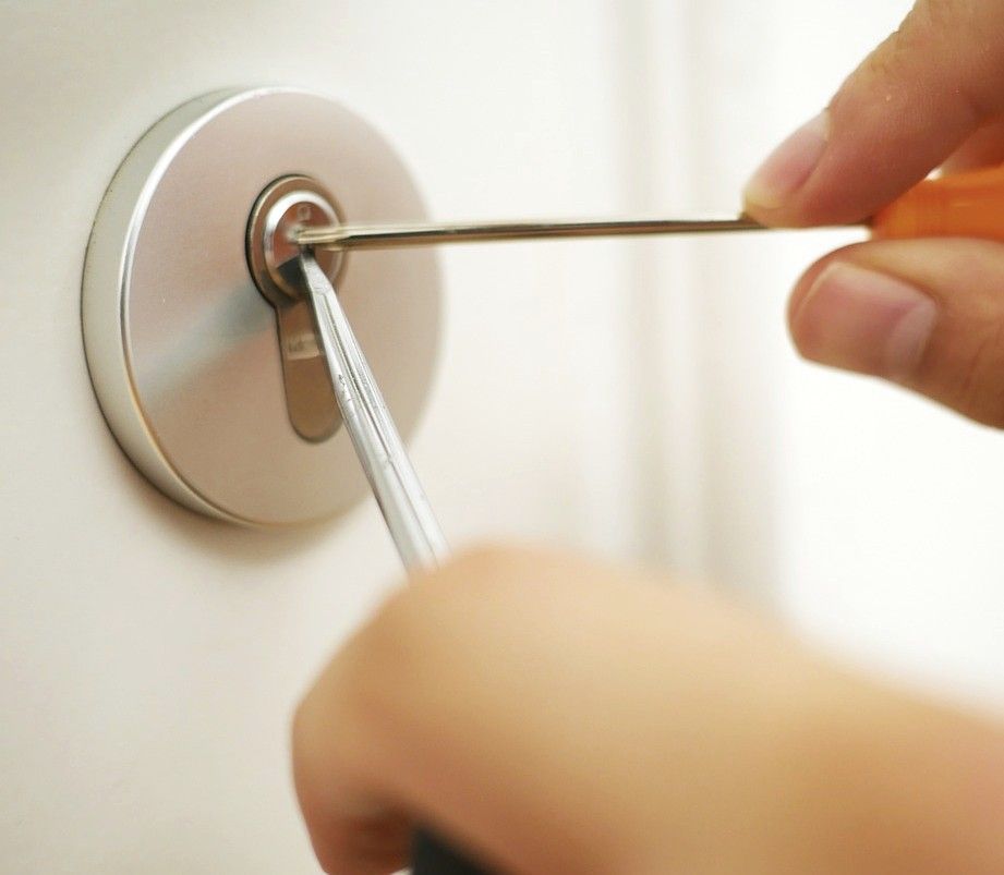 A  circular lock being picked.