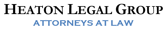 Heaton Legal Group logo with “Attorneys at Law” in black and blue text