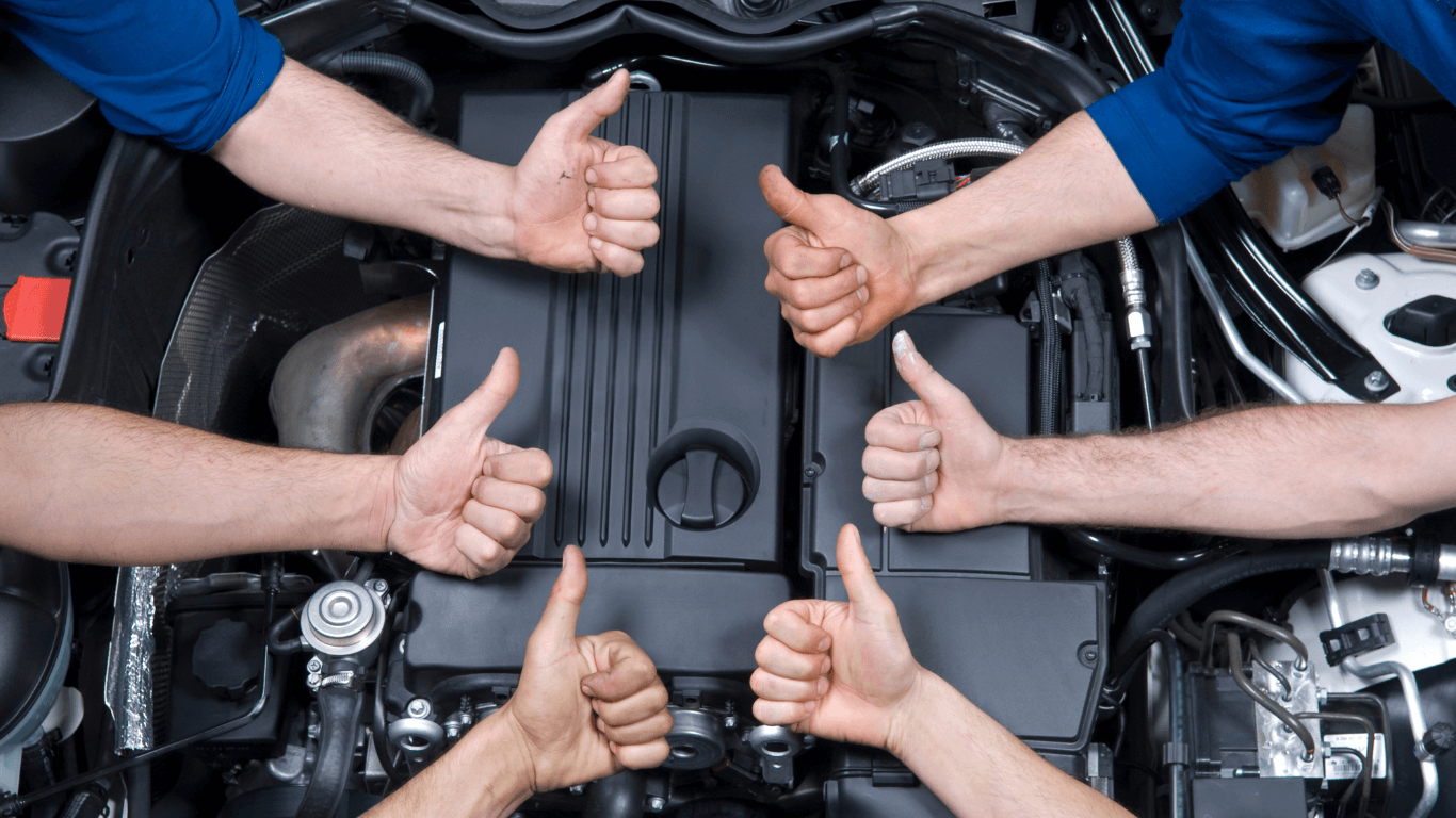mechanics giving thumbs up