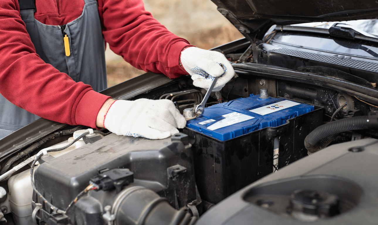 a mechanic doing a battery replacement