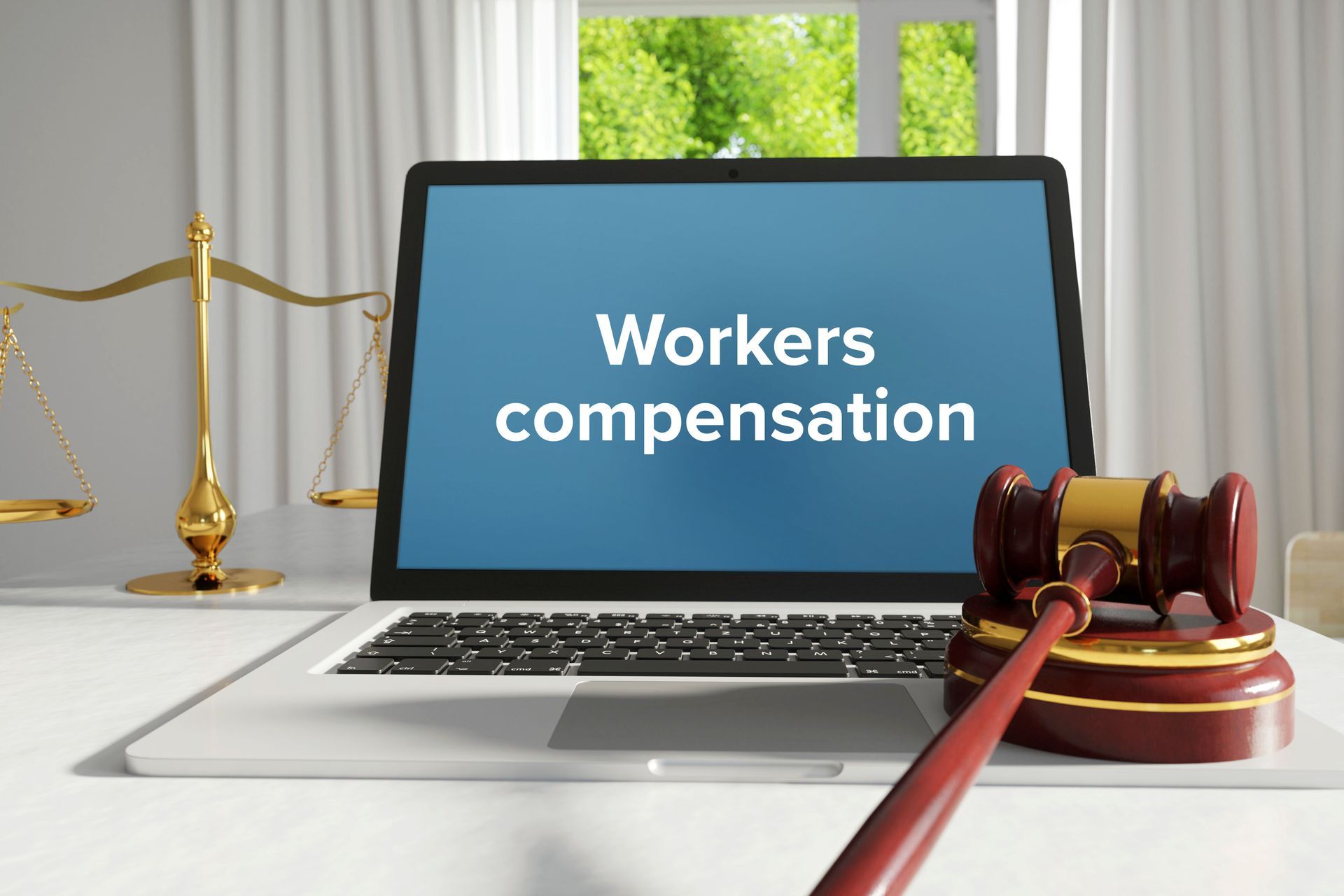 A workers' compensation lawyer's laptop is on a desk in the office with a text on the screen. A workers' compensation lawyer's laptop is on a desk in the office with a text on the screen.