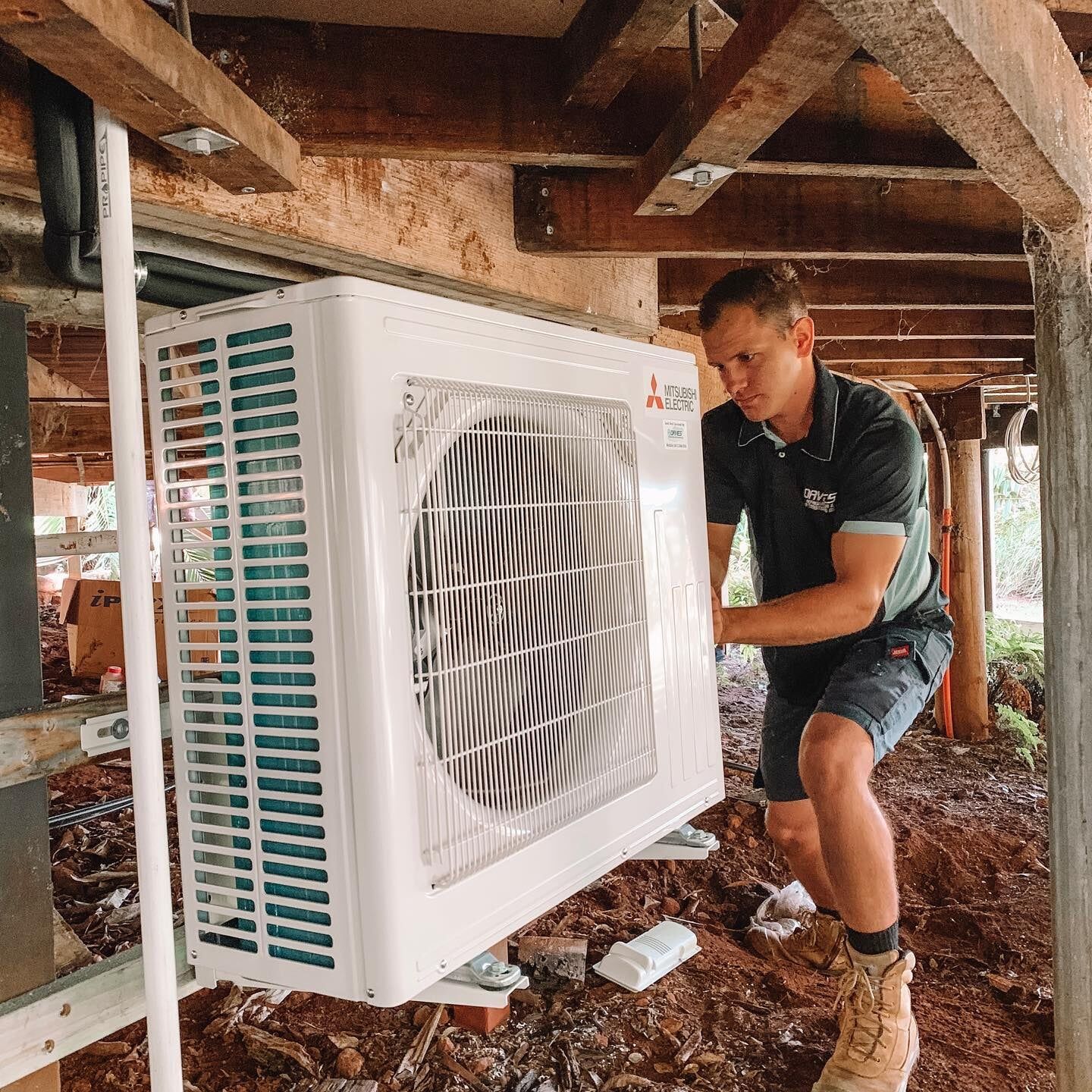 Air Conditioning Technician installation AC unit in Sunshine Coast home