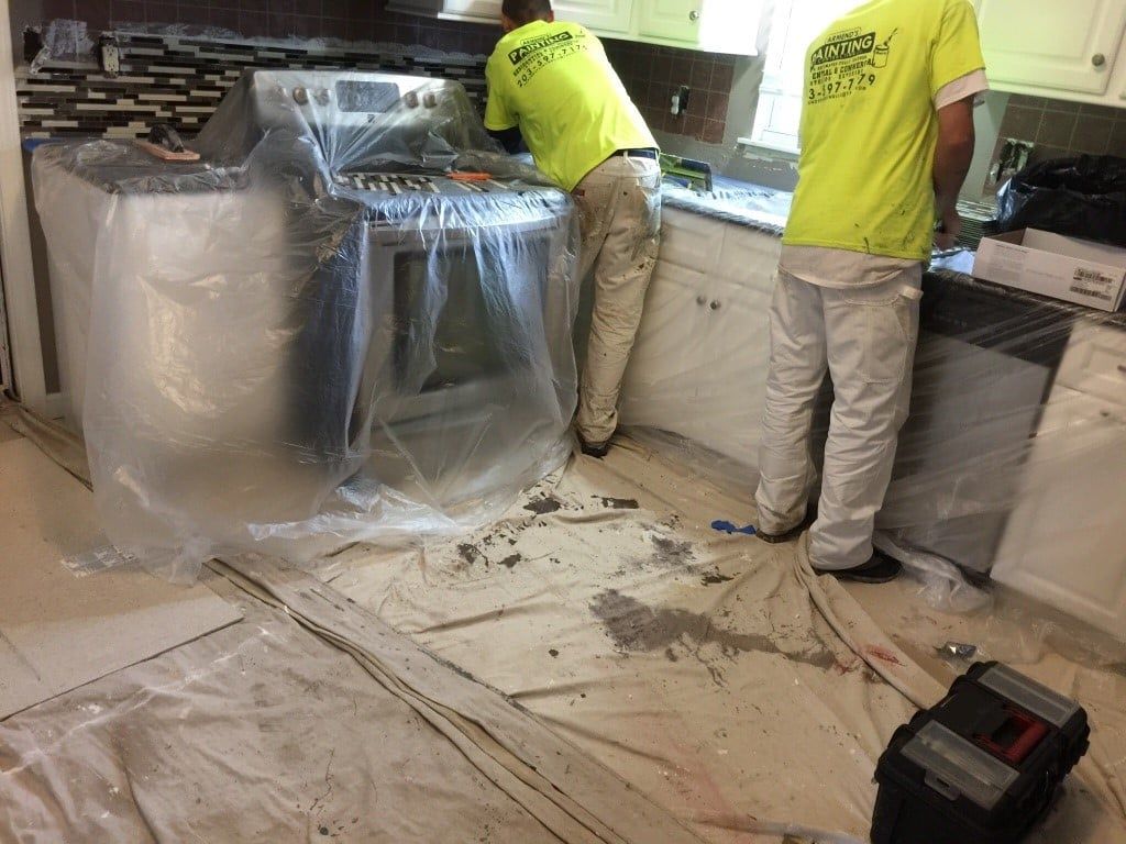 Workers in Kitchen — Waterbury, CT — Armend's Painting and Home Improvement