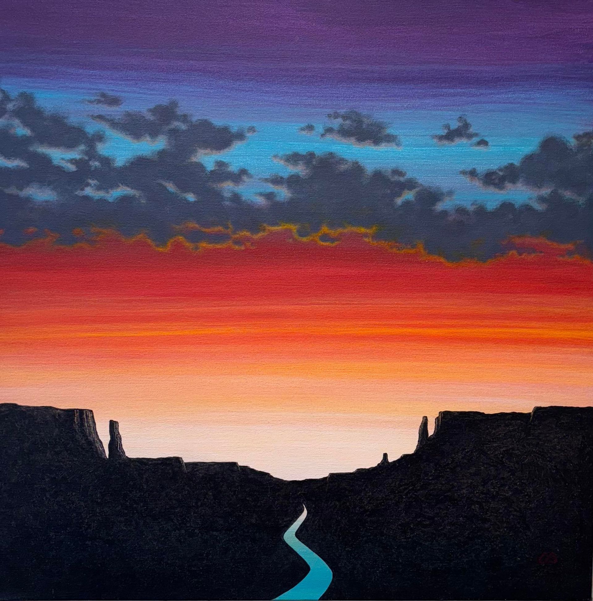 Sunset over rolling hills, warm colors of red, orange, and yellow in the sky.