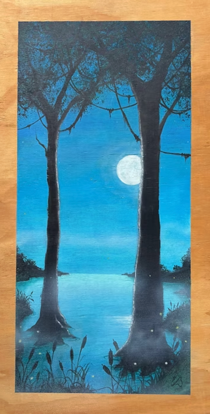 Night scene: Two dark trees frame a full moon over a lake with reflections. Blue and black tones.