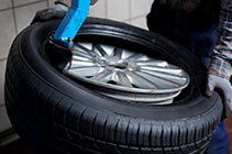 Mechanics Removing Tire — Vehicle Repairs in Grafton, NSW