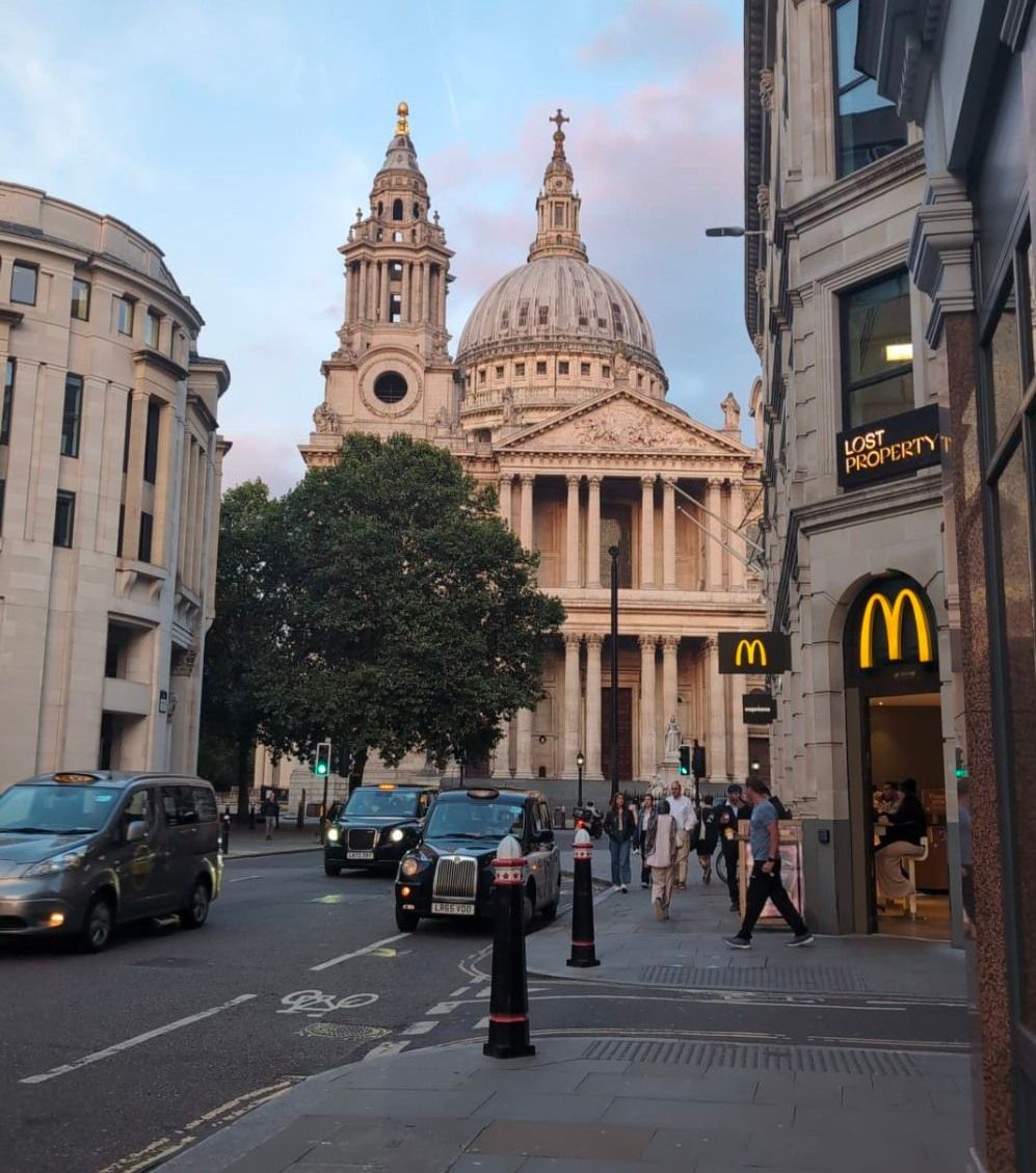 A mcdonald 's sign is on the side of a building