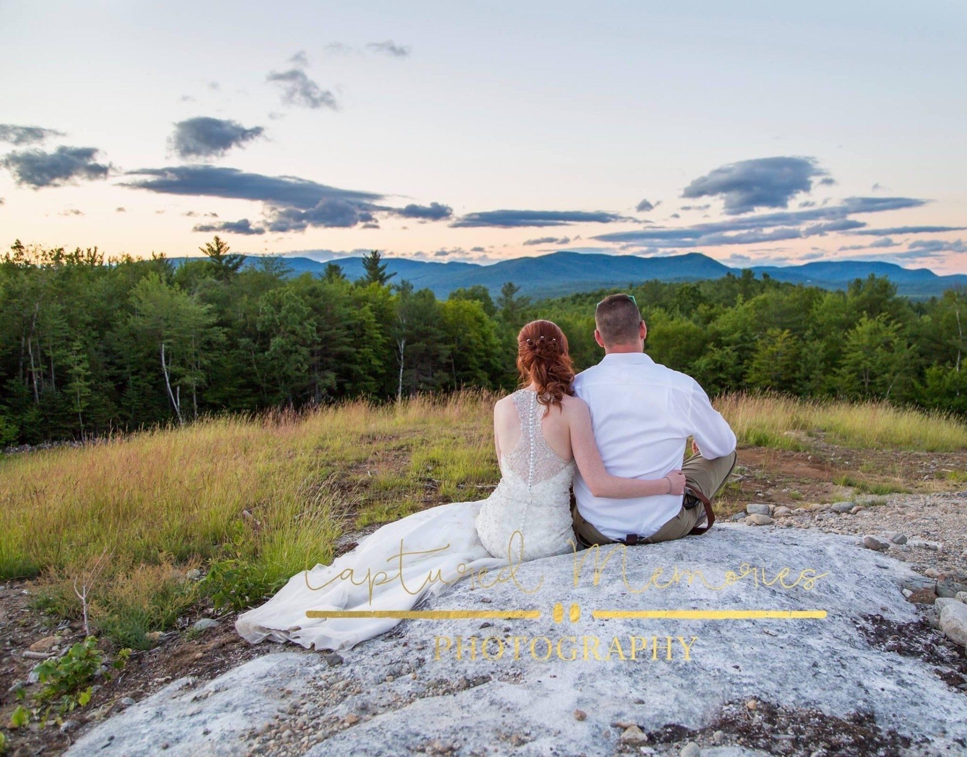 Couple Sitting On A Rock — West Paris, ME — TL Barn