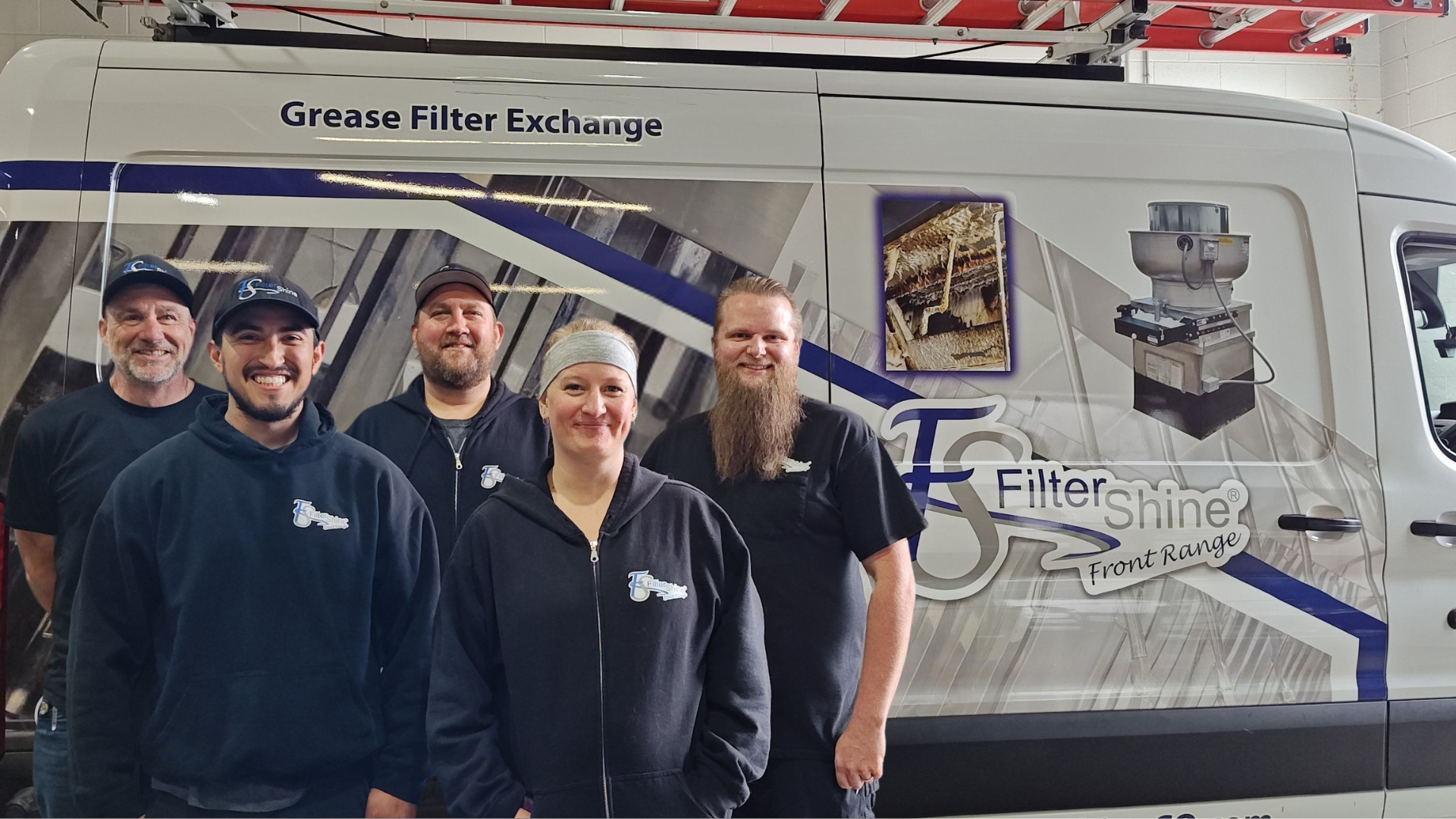 A group of people standing in front of a van.