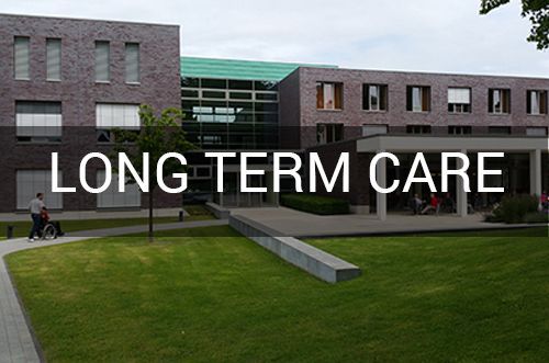 A large brick building with the words long term care written on it