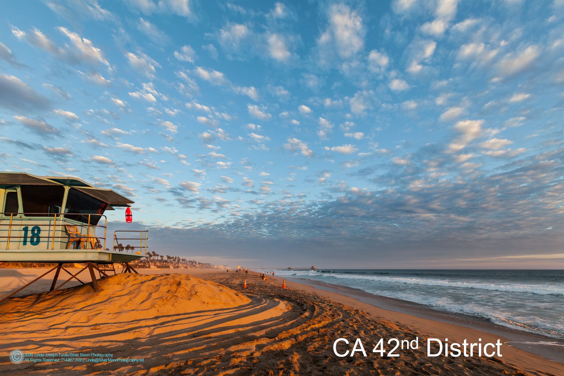 Phil Turek for US Congress Beach scene with lifeguard station under a cloudy sky in California's 42nd District.