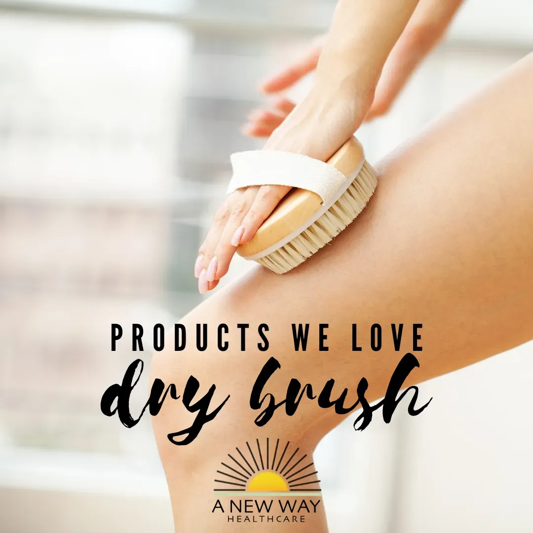 Person dry brushing their leg with a brush. Text reads: Products We Love, dry brush. A New Way logo at the bottom.