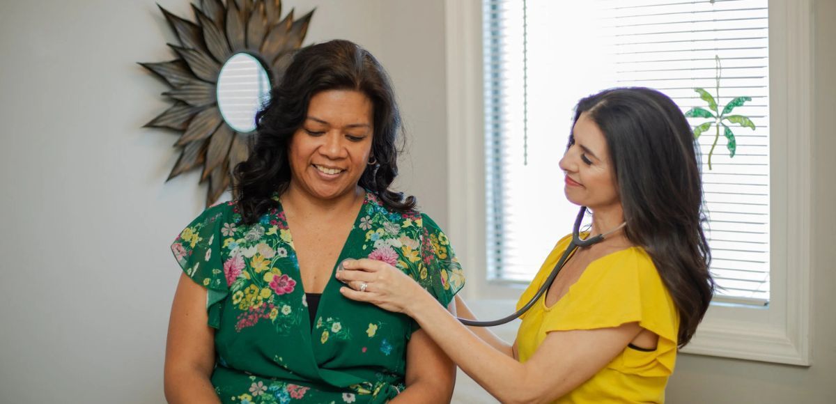 Direct Primary Care provider and patient in exam room