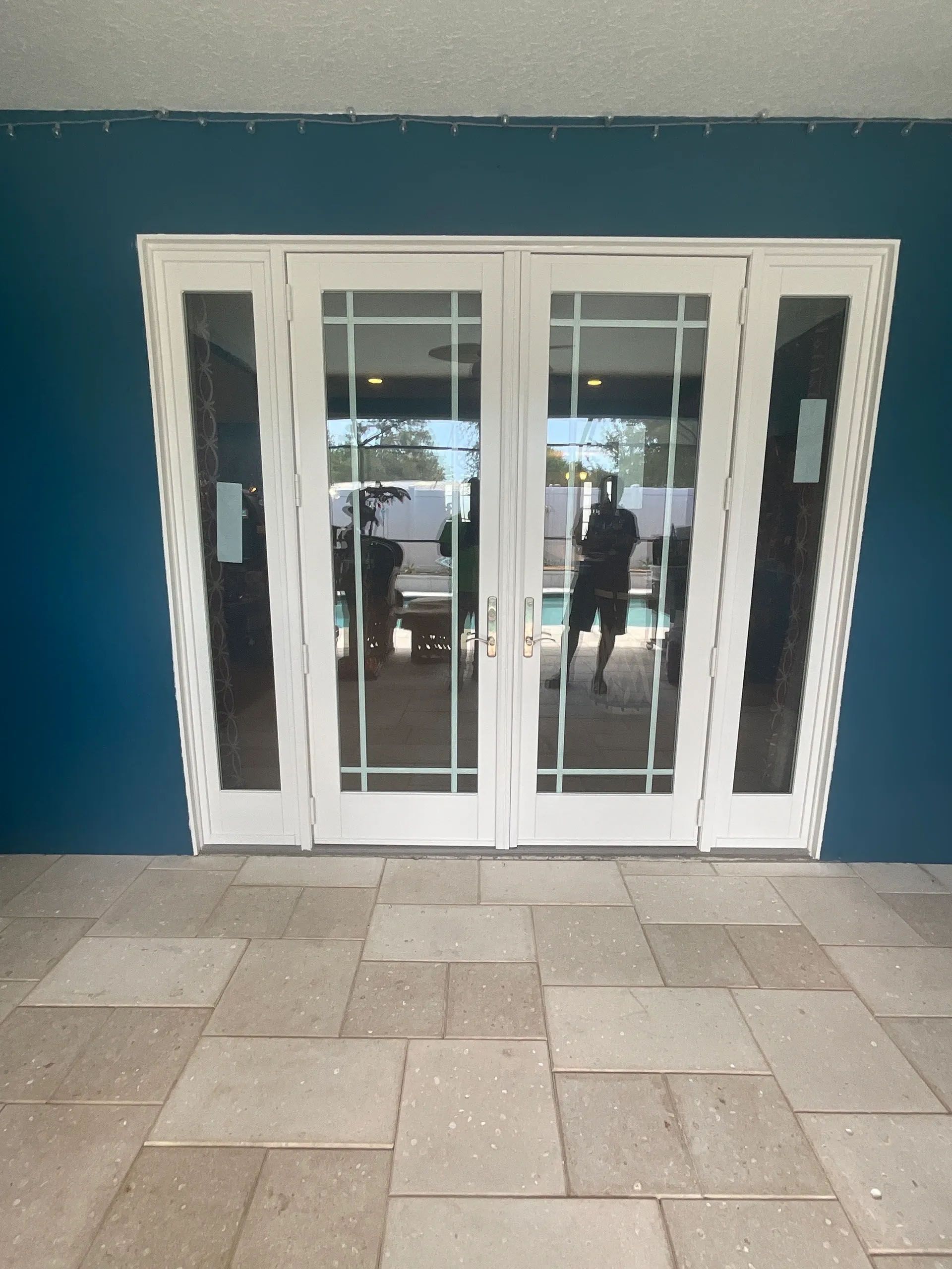 A white door with a blue wall behind it