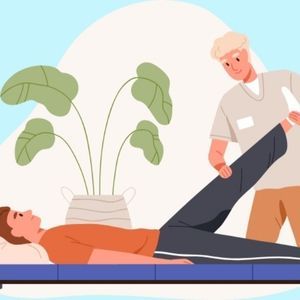 A man is laying on a table getting a chiropractic treatment from a chiropractor.