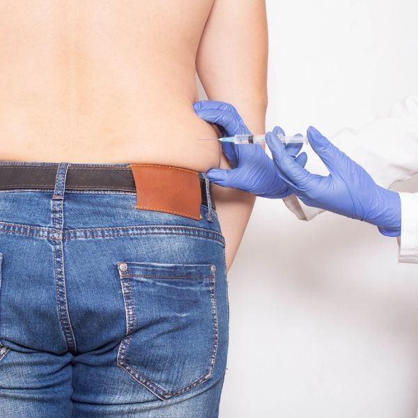 A man getting an injection for burning fat