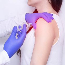 a woman is getting a shoulder injection