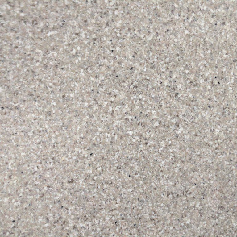 A close up of a gray granite counter top.