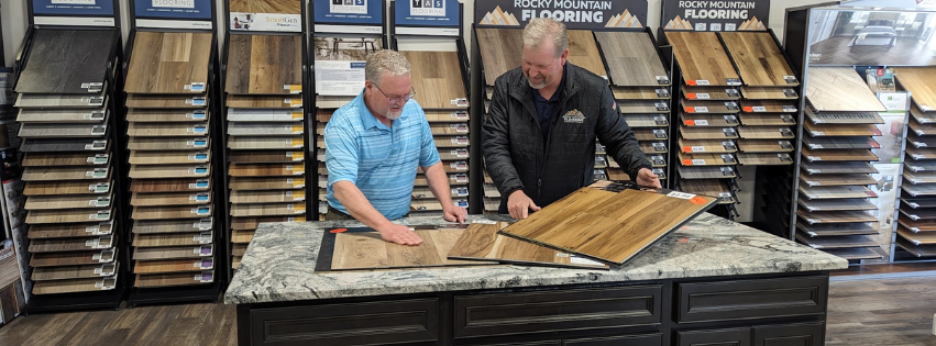 2 people looking at flooring