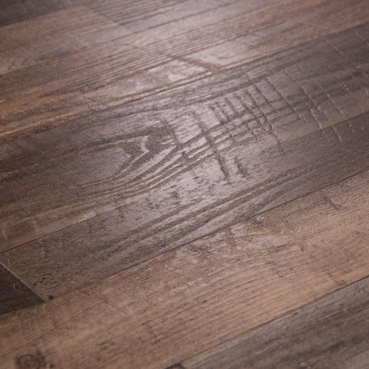 A close up of a wooden floor with a pattern on it.